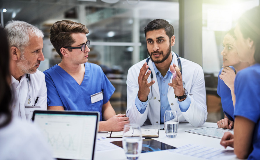 Multiple doctors discussing 