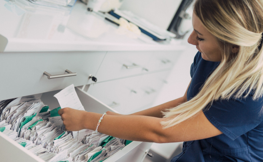 nurse searching for files - diabetes