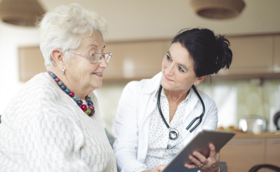 Nurse talking to old lady